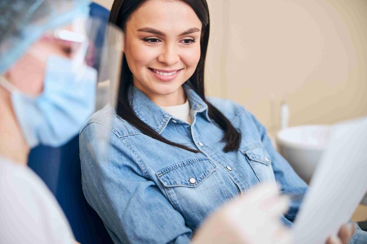 Patient discussing Invisalign Plano, TX treatment options with an orthodontist